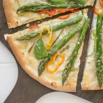 A slice of spring vegetable pizza closeup