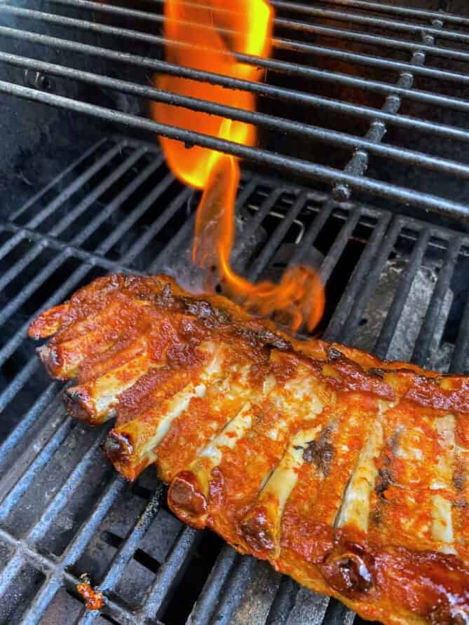 Ribs on the grill with a flame