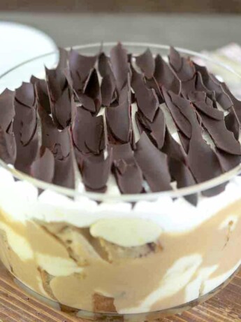 A sticky toffee pudding trifle topped with chocolate shavings