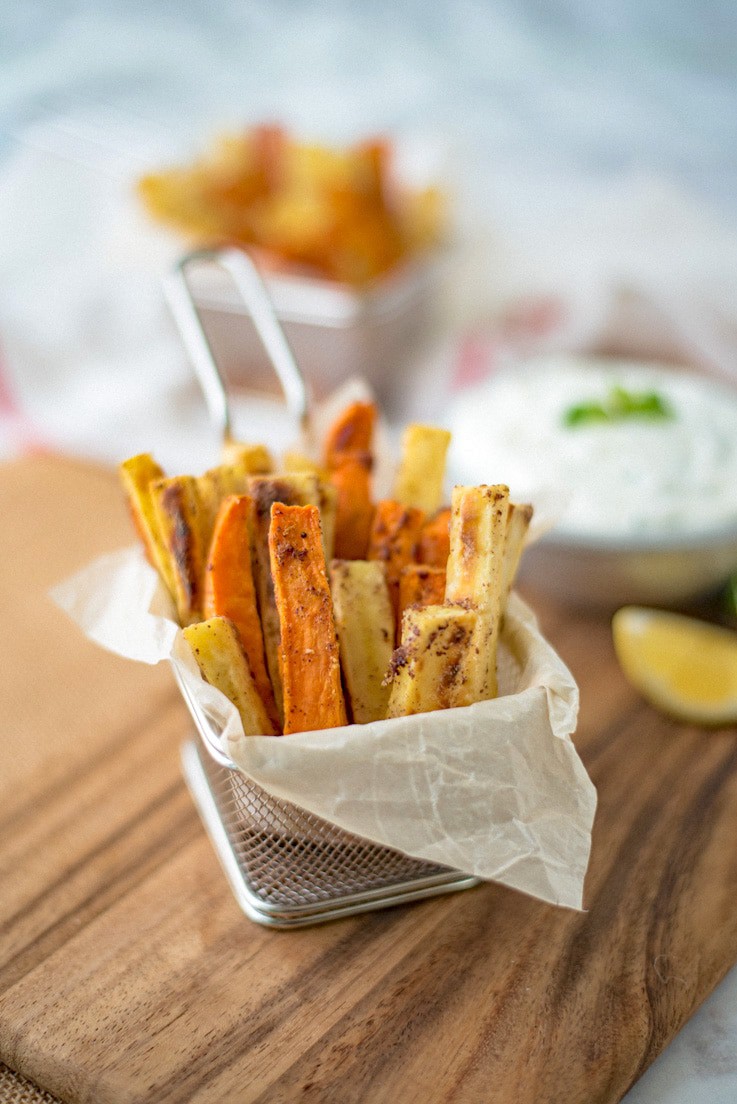 Sumac baked sweet potatoes with mint yogurt dip make a great game day snack, appetizer or serve with breaded fish for different take on fish & chips.