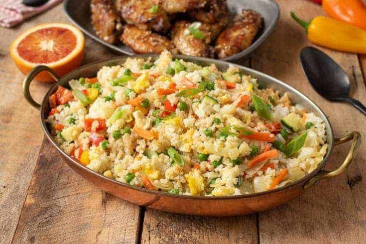 Colorful vegetable fried rice in an oval serving dish