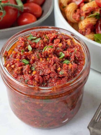 Sun-dried tomato pesto in a glass jar