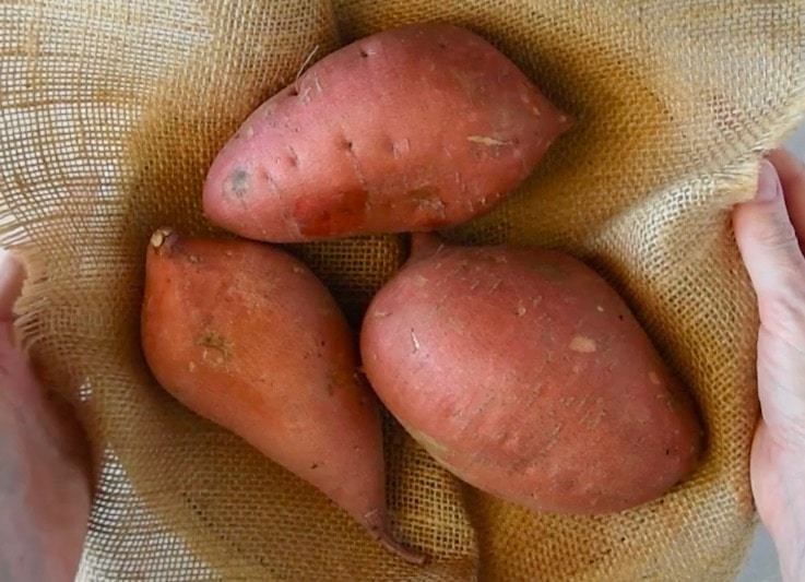 3 sweet potatoes ready to be cooked