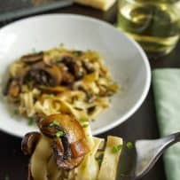 A forkful of pasta with mushrooms
