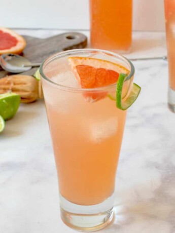 2 glass of tequila Paloma cocktail with fresh lime and grapefruit