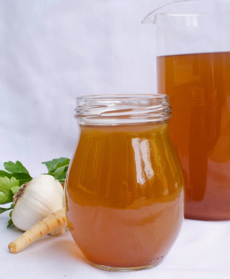 A pitcher and a jar of vegetable stock