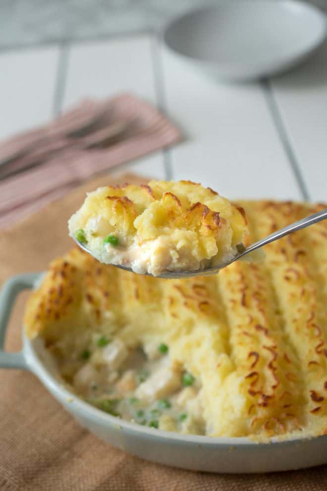 Serving a spoonful of fish pie
