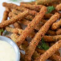 Breaded and fried green beans with a creamy sauce