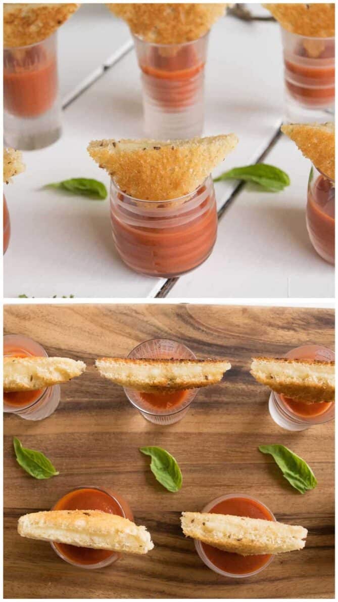 A selection of mini glasses filled with tomato soup topped with mini grilled cheese sandwiches