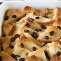 Perfectly browned top of bread and butter pudding with raisins