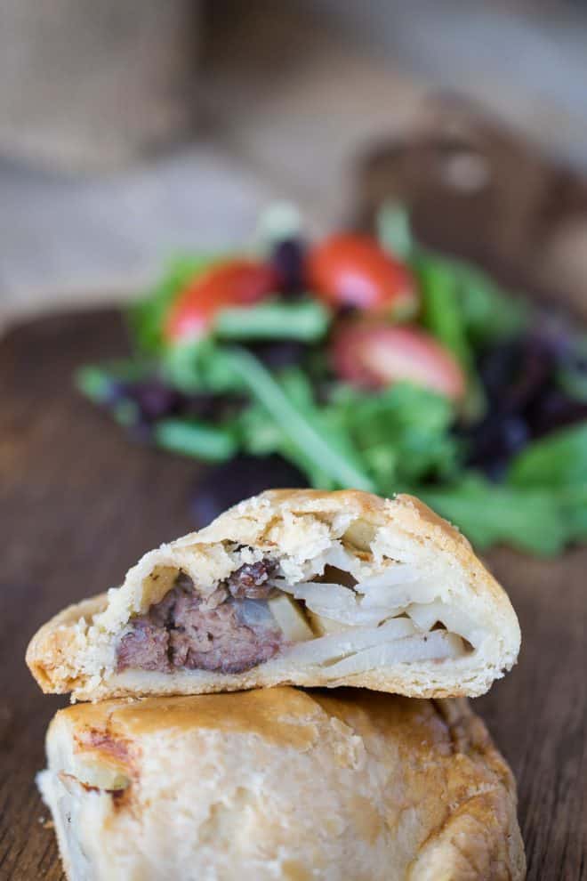 A Cornish pasty cut in half showing the beef and vegetables inside