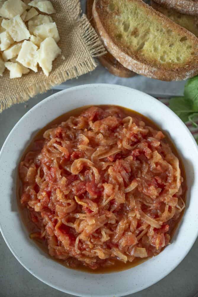 Friggione (cooked onions and tomatoes) in a large bowl viewed from overhead