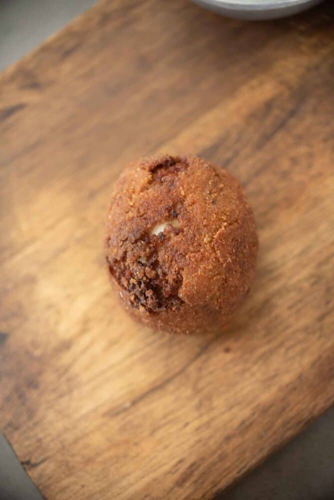 A fried Scotch egg that split while frying