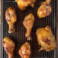 Freshly fried Turmeric Spiced Fried Chicken on a cooling rack