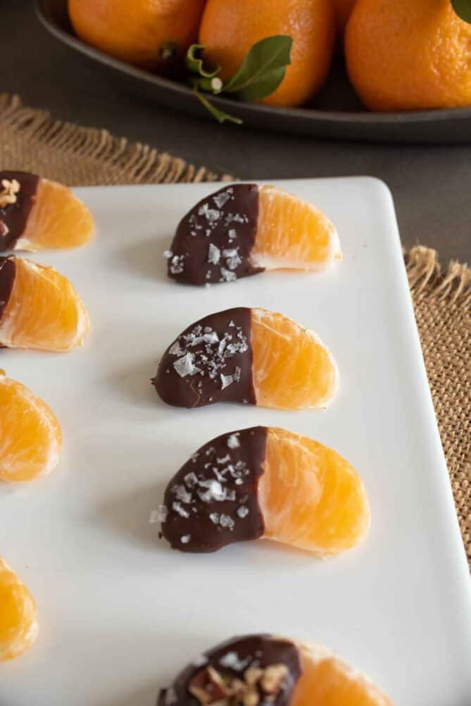 Tangerine segments dipped in chocolate and topped with flaky sea salt