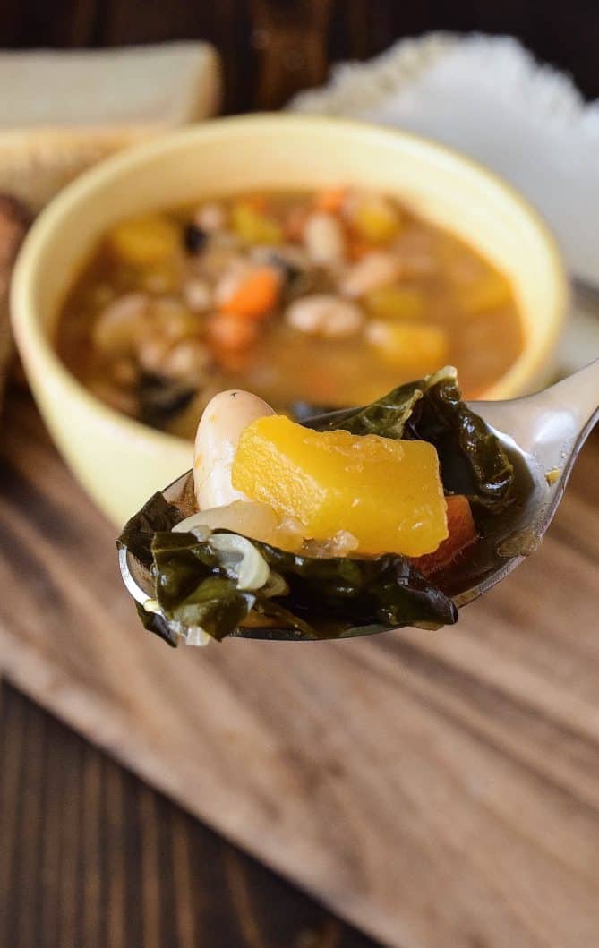 A spoonful of kale, beans and vegetables from Tuscan beach soup