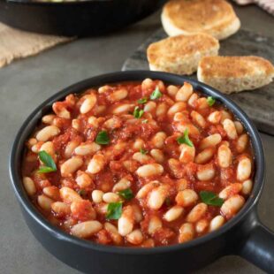 Cannellini beans cooked in crushed tomatoes with toasted bread