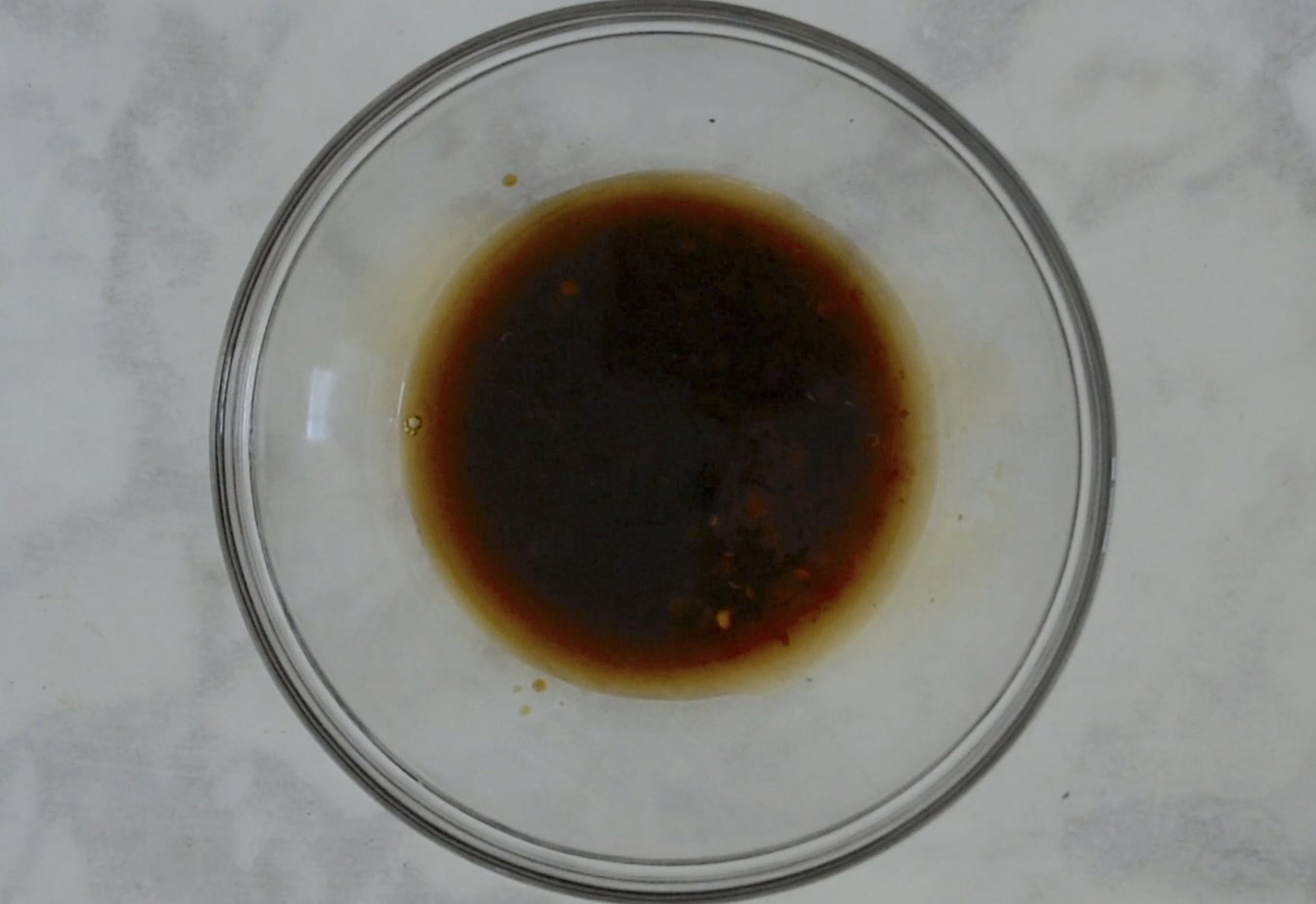 Spicy soy sauce in a glass bowl