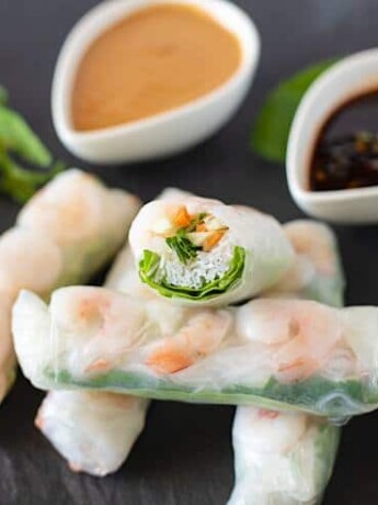 A closeup of the inside of one of the rolls, green white and orange colors