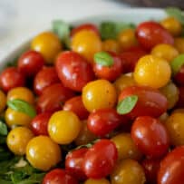 A closeup of red and yellow cherry tomatoes