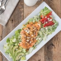 Buffalo chicken, peppers, avocado, blue cheese served over lettuce