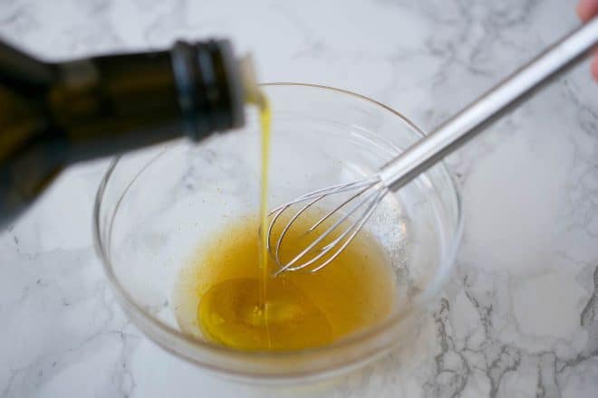 Drizzling oil to make salad dressing