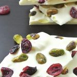A closeup showing the dried cranberries and pistachios in white chocolate