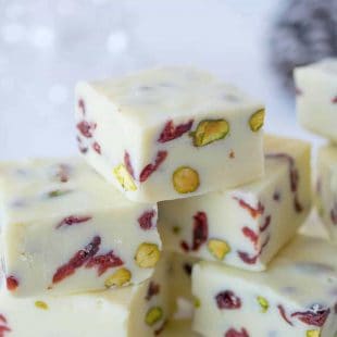 Pretty red dried cranberries and green pistachios inside White Chocolate Pistachio Cranberry Fudge