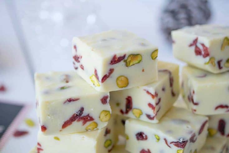 Pretty red dried cranberries and green pistachios inside White Chocolate Pistachio Cranberry Fudge