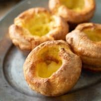 A closeup of 4 Yorkshire pudding fresh out of the oven