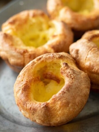 A closeup of 4 Yorkshire pudding fresh out of the oven