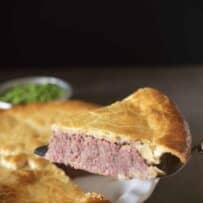 A slice of corned beef and potato pie